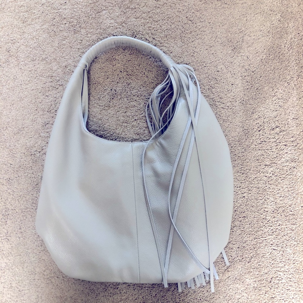 Brand new gray leather bag b-low the belt